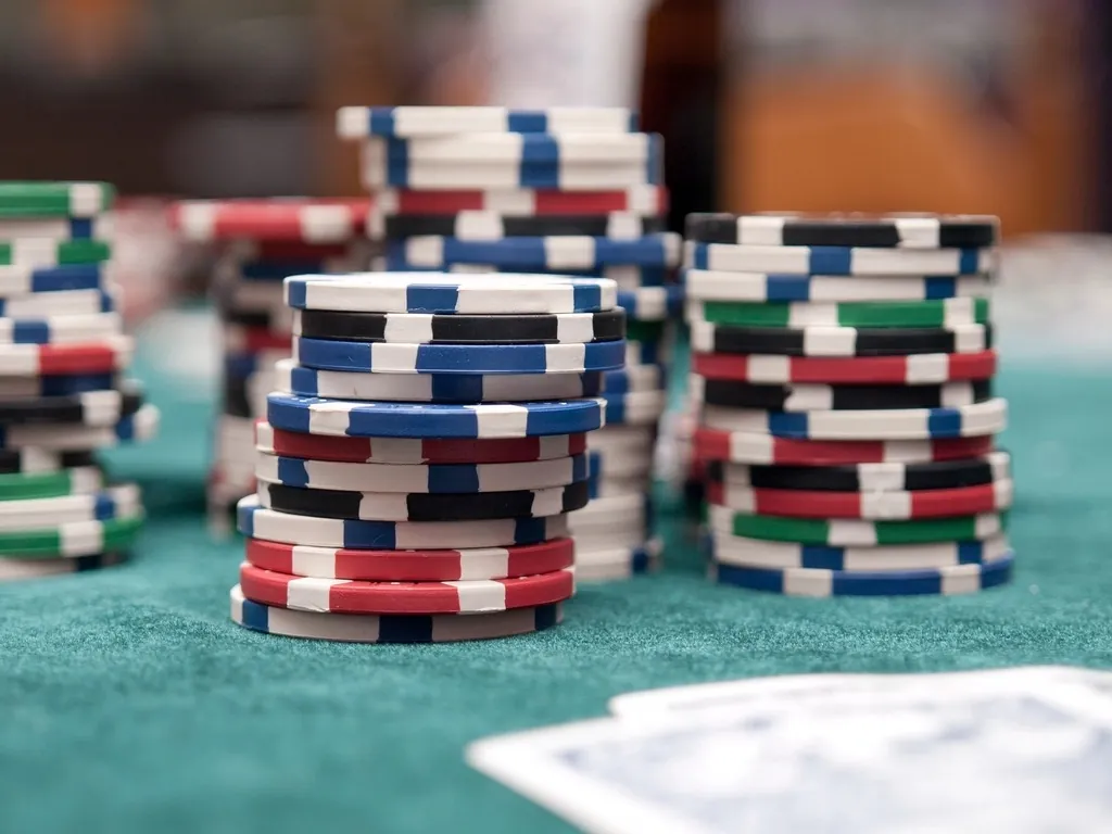 Chips and hole cards on a poker table